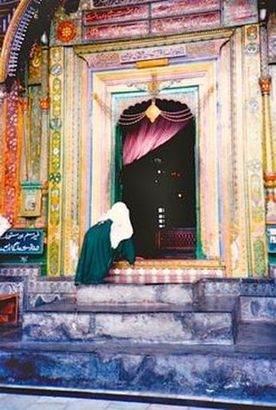 Woman peeking in temple in Kashmir, India