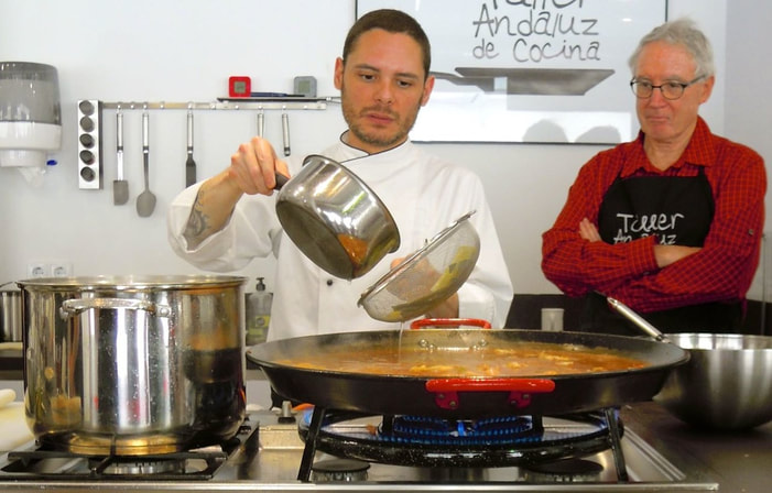 Karen McCann | Chef Victor of Taller Andaluz de Concina, preparing paella with Rich McCann