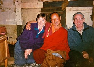 Bhutan, Karen & Rich McCann with buddhist monk in monastery