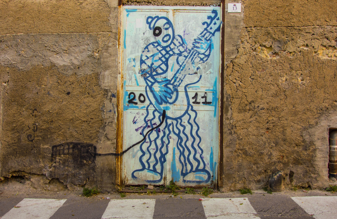 Rock guitar graffiti | Tourist-Free Sardinia, Italy | EnjoyLivingAbroad.com
