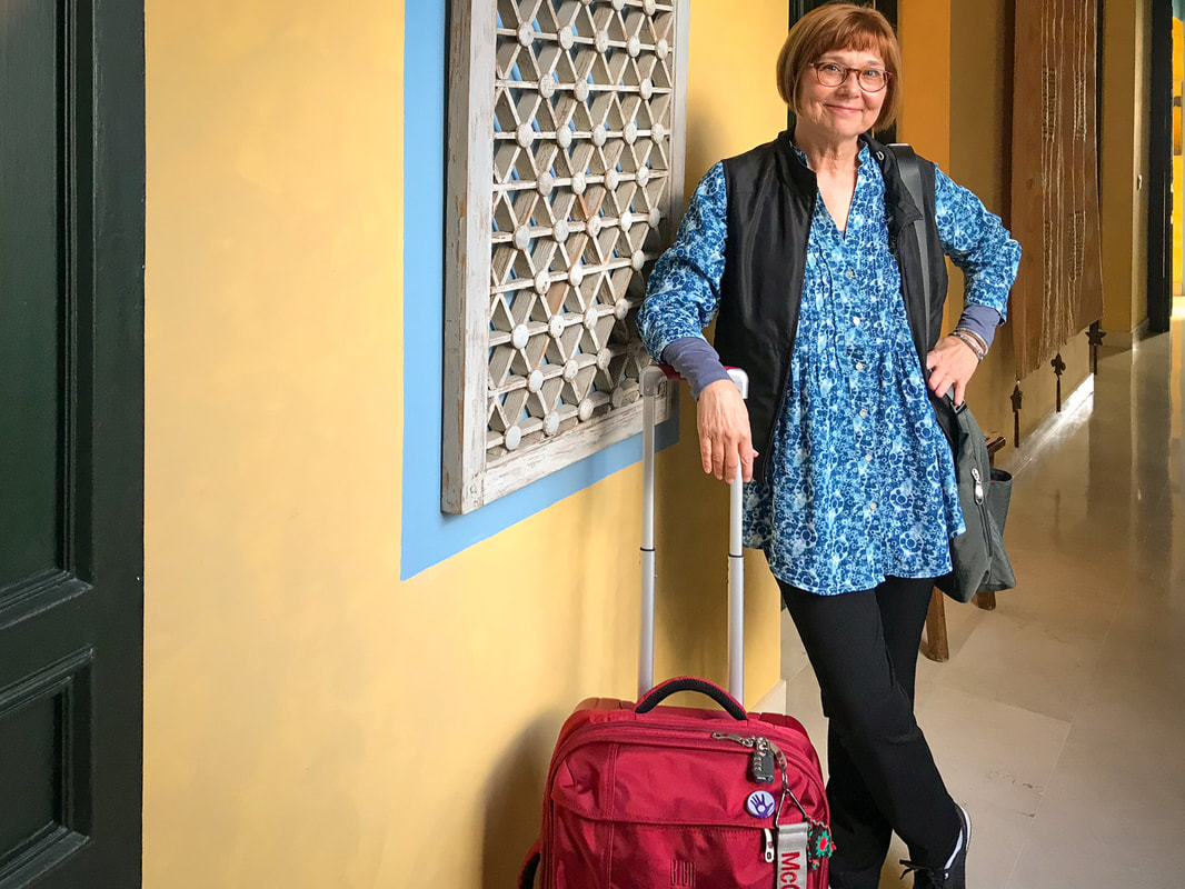 Karen McCann's Minimalist Luggage / Packing 1 Small Carry-on for 4 Months on the Road / Karen McCann / EnjoyLivingAbroad.com
