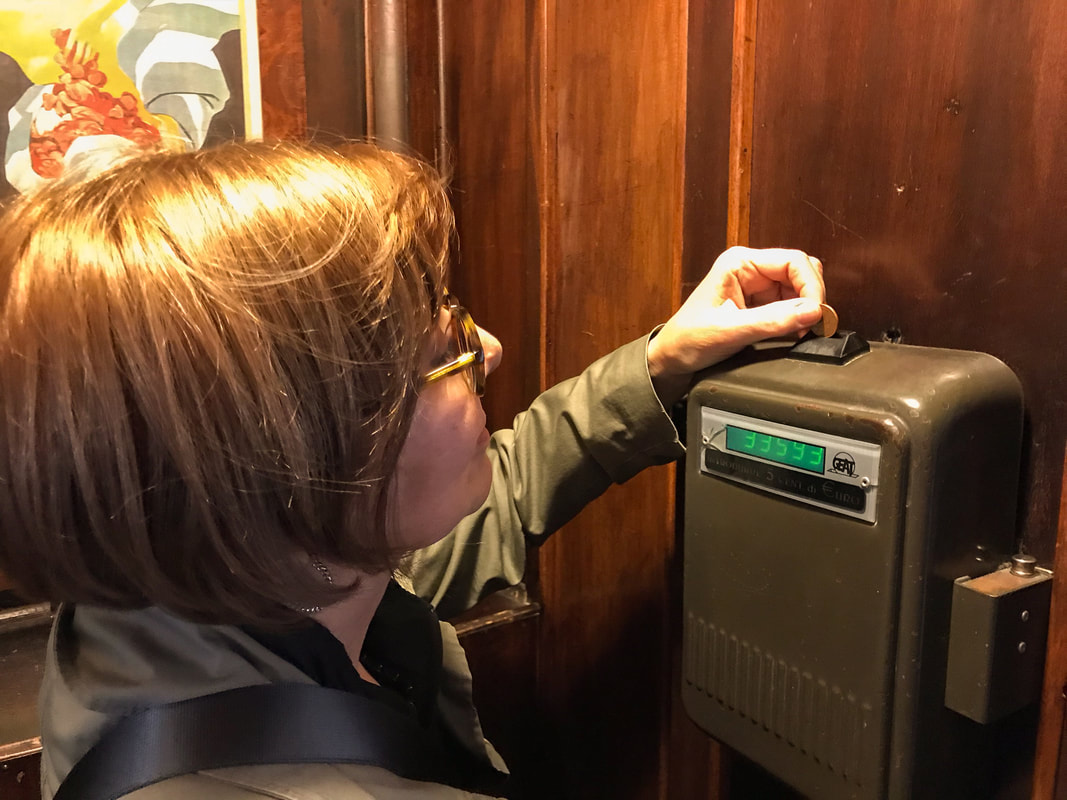 Coin-operated elevator / Naples, Italy: Embrace the Chaos / Karen McCann / EnjoyLivingAbroad.com