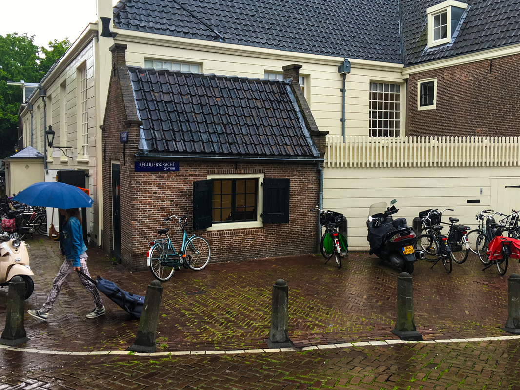 Rainy, Zany Amsterdam / world's smallest office / Karen McCann / EnjoyLivingAbroad.com