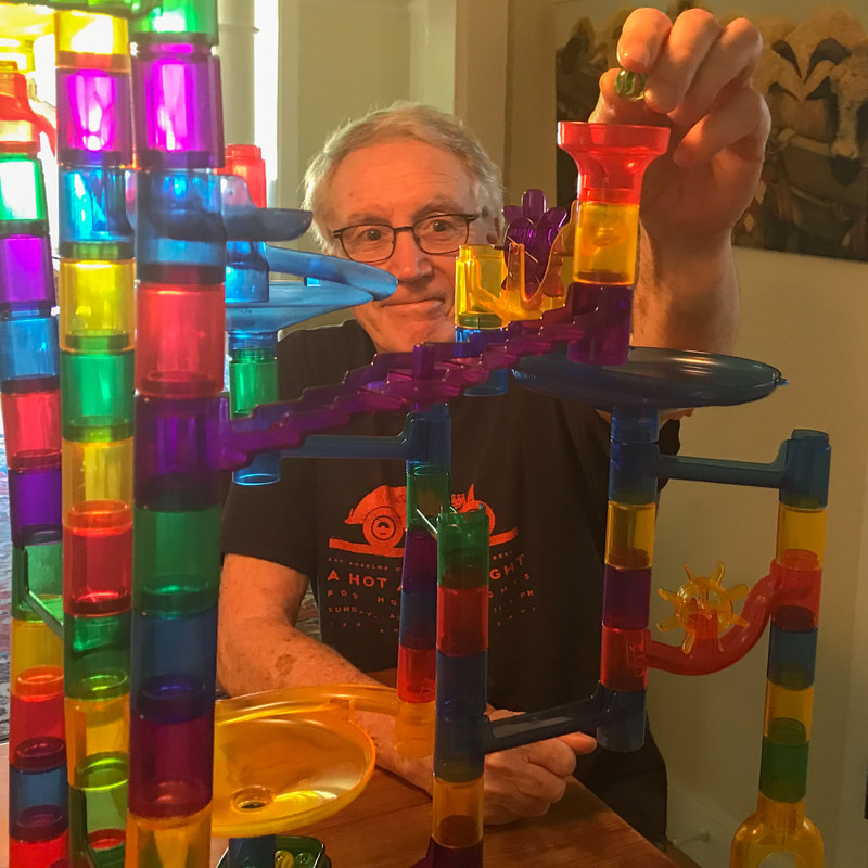 Rich McCann builds marble run / Losing Our Marbles? Coping with the News / Karen McCann / EnjoyLivingAbroad.com