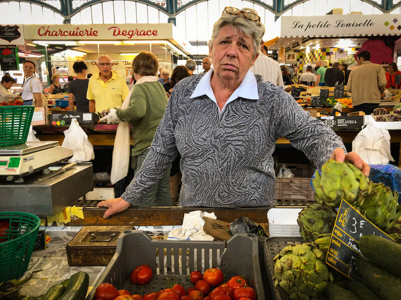 Dijon, France vegetable seller / Travel as preparation for pandemic / Karen McCann / EnjoyLivingAbroad.com
